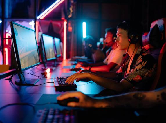 Players competing at gaming PCs during a tournament